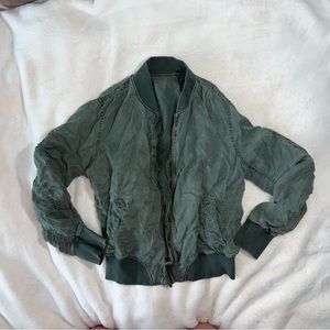 Green bomber jacket zip up flame resistant